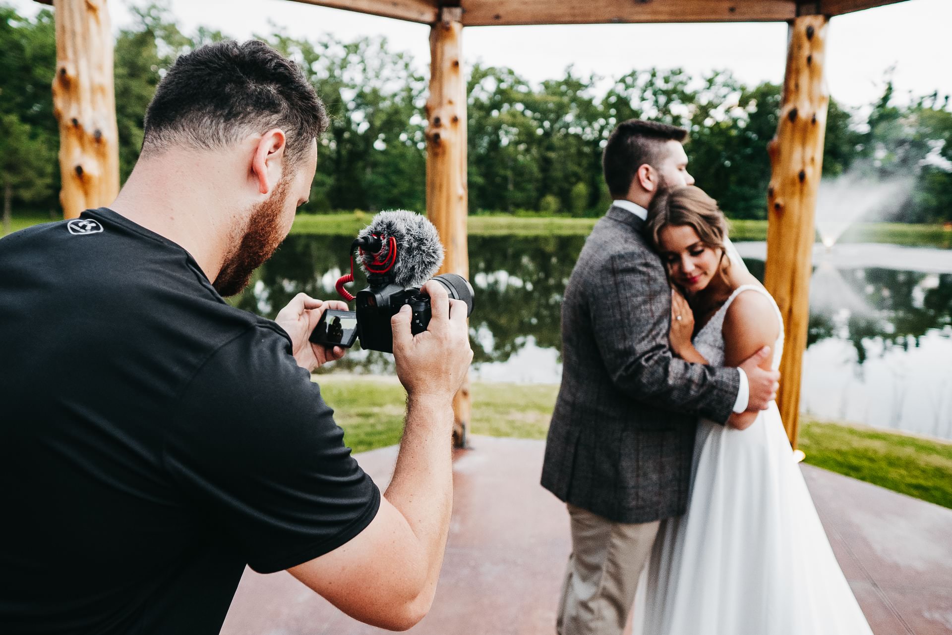 wedding videographer recording bride and groom