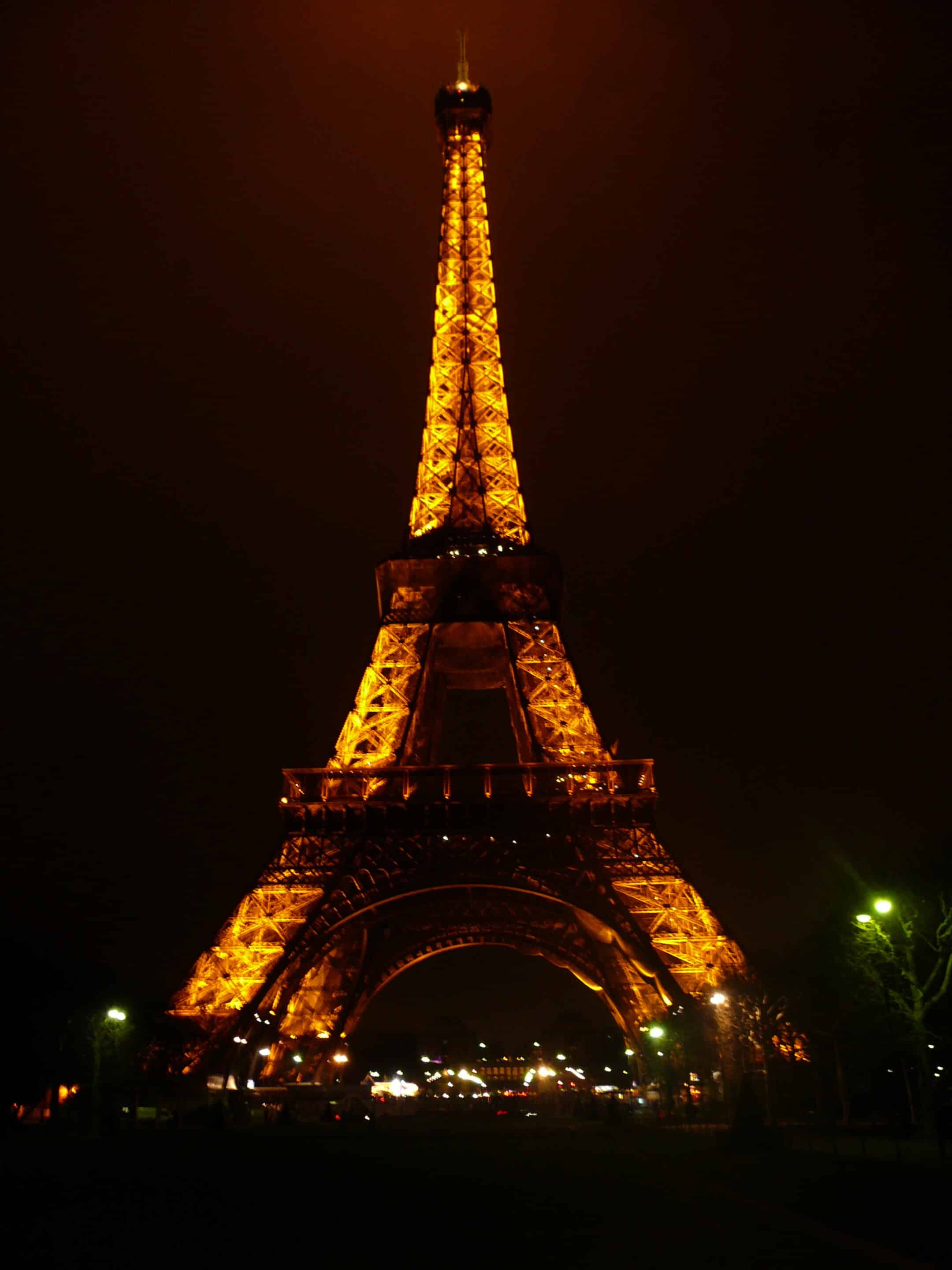 Low-quality photo of the Eiffel Tower at night in Paris, France